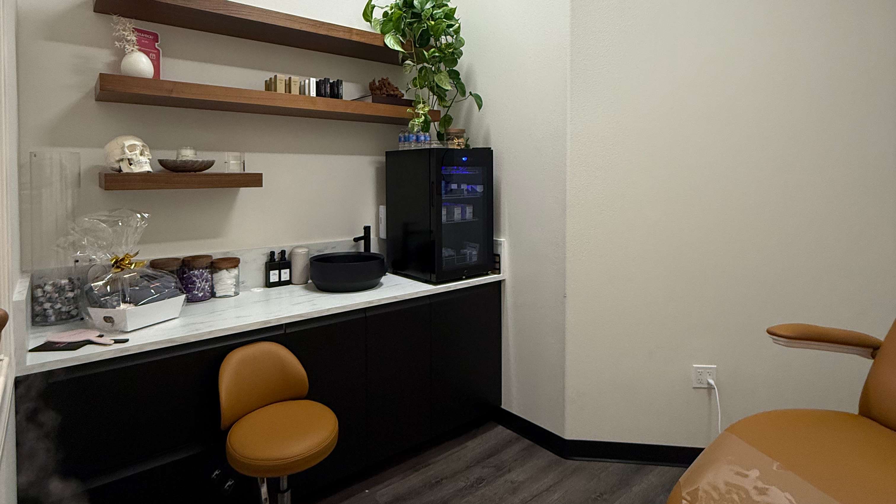 Clean, professional medical spa treatment room with neutral tones at Routine Wurk in Long Beach