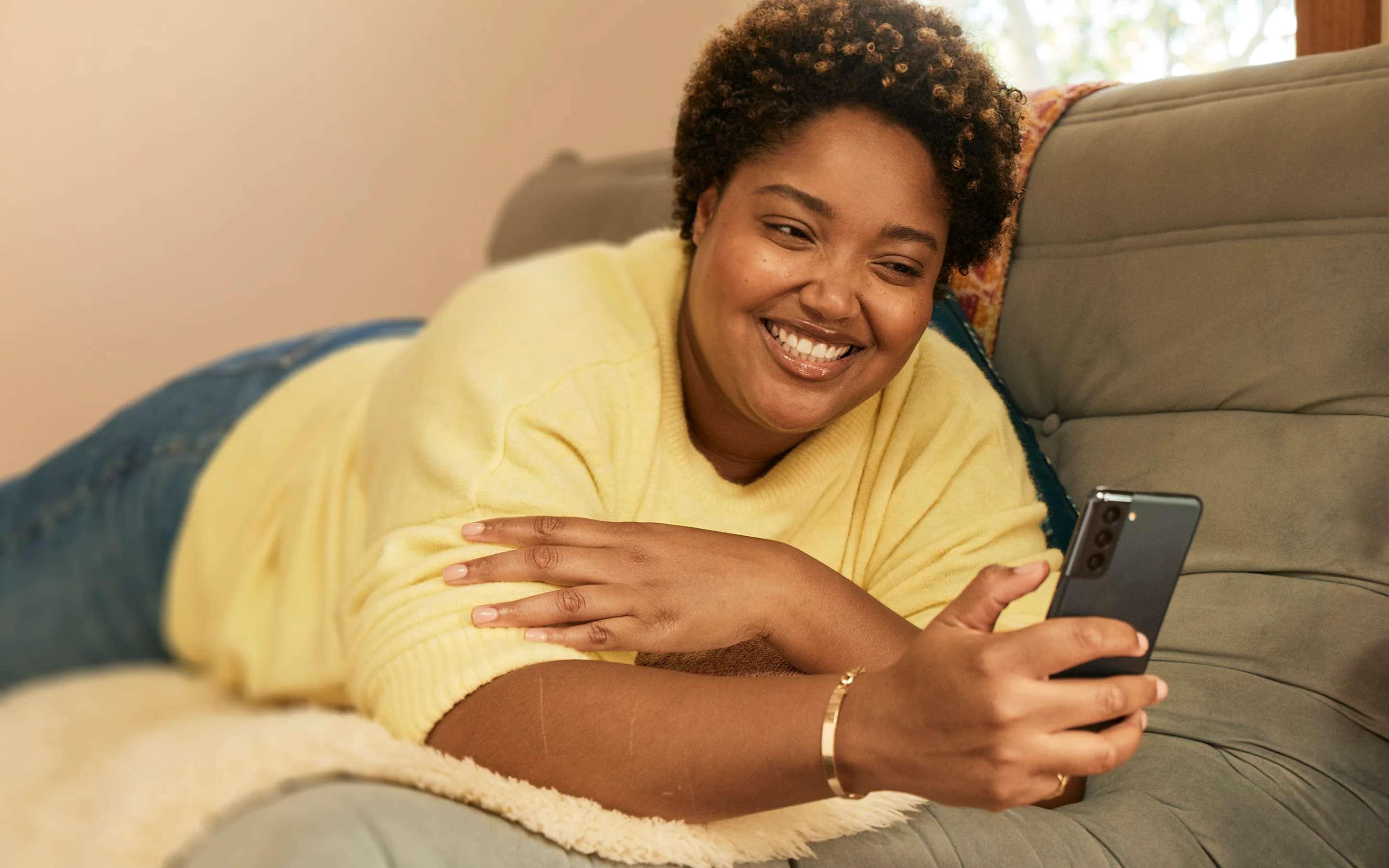 Botox female model laying down with phone