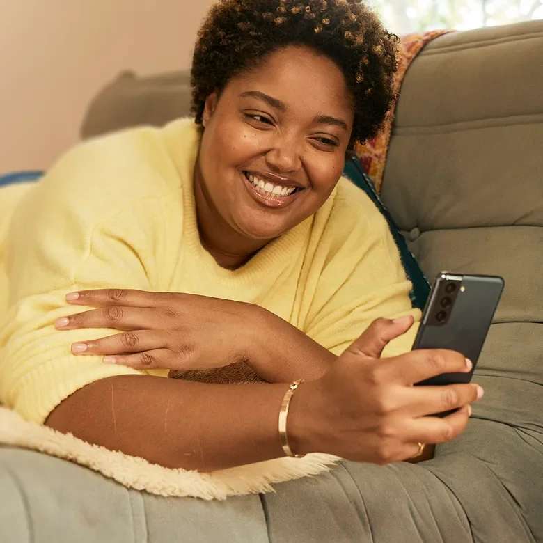 Botox female model laying down with phone