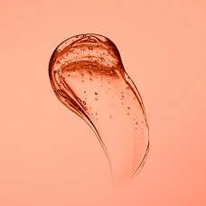 An glob of orange paint on an orange background