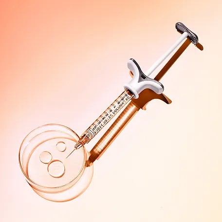 A needle pointing vertically down going into a via of JUVÉDERM® Collection of Fillers